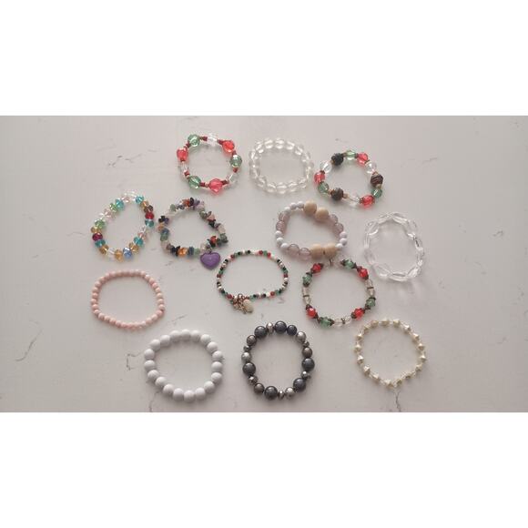 Bundle 13 bracelets included ranging from Crystal plastic wood metallic beading. - Picture 1 of 7